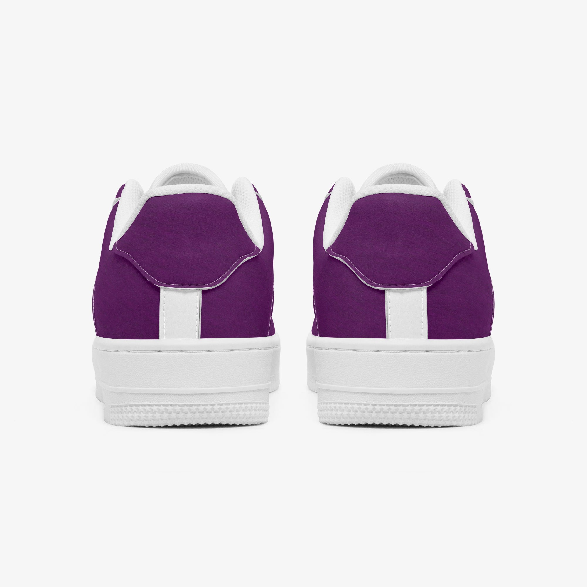 Pair of classic purple low-top leather sneakers with white soles and heel accents, viewed from the back.