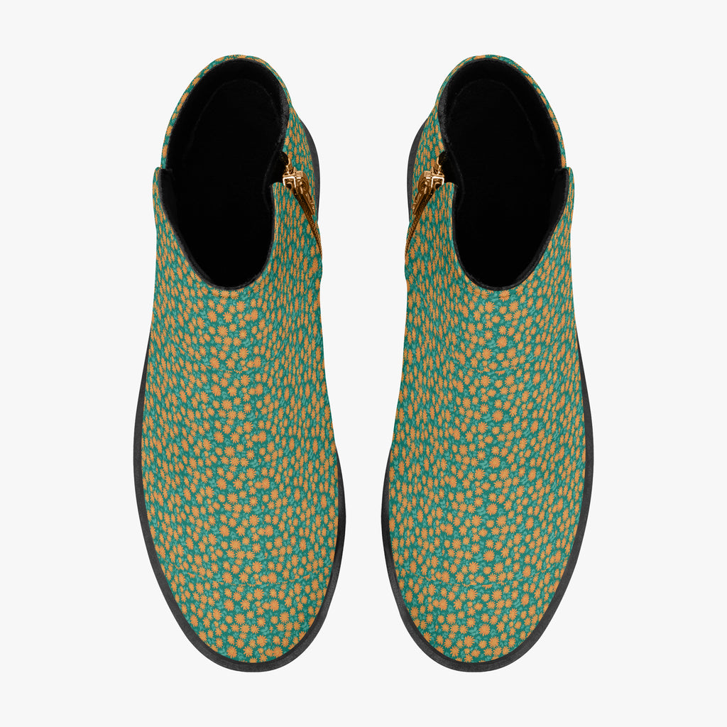 Teal ankle boots with orange floral print, chunky black heels, and side zipper closure.