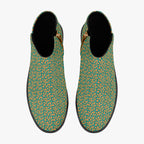 Teal ankle boots with orange floral print, chunky black heels, and side zipper closure.