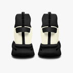 Black and white high-top mesh knit sneakers with cushioned black soles, rear view.