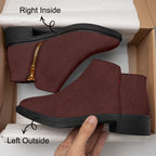 Burgundy corduroy ankle boots with gold zipper and chunky black heel in a box.