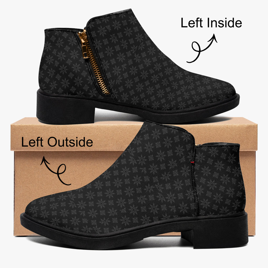 Black ankle boot with subtle gray snowflake print, gold zipper, and chunky heel, shown from inside and outside views on a.