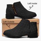 Black ankle boot with subtle gray snowflake print, gold zipper, and chunky heel, shown from inside and outside views on a.