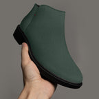 Dark green textured ankle boot with chunky black heel and smooth rounded toe.