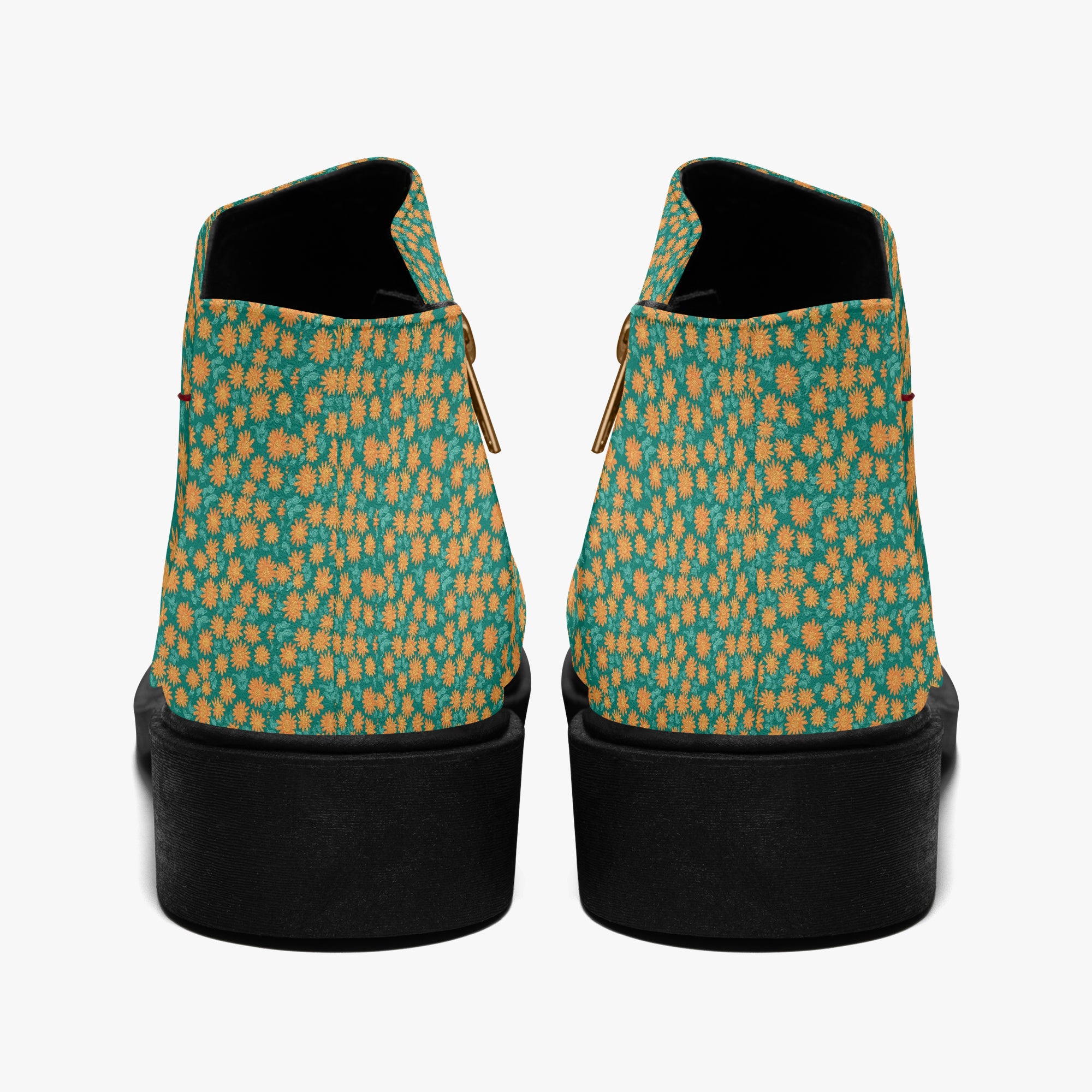 Teal ankle boots with orange floral print and chunky black heels, rear view with visible zippers.