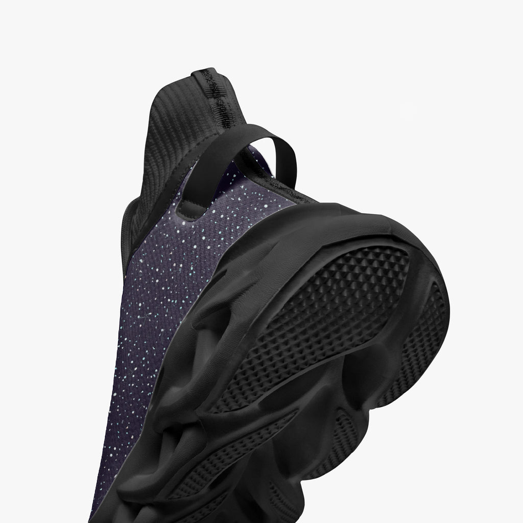 Black high-top sneakers with cosmic white speckle knit upper and thick textured sole.