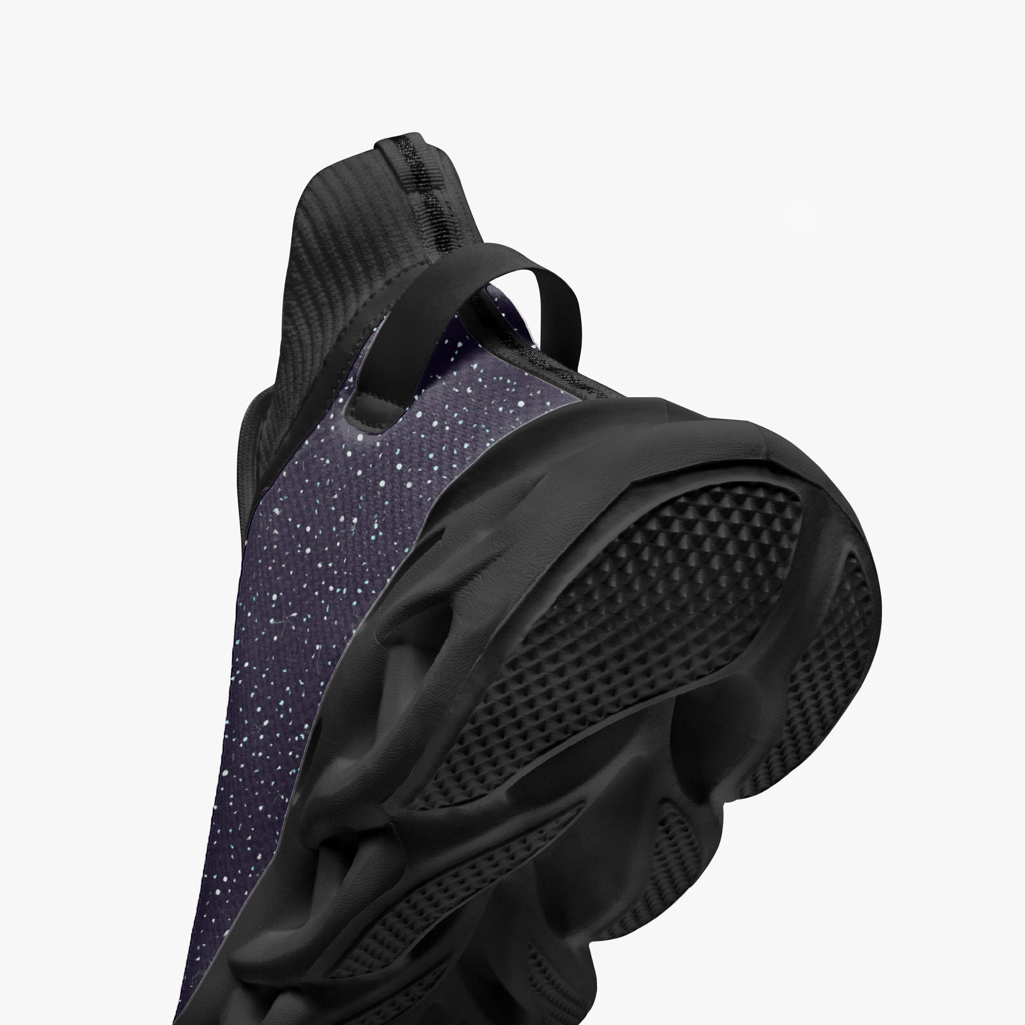 Black high-top sneakers with cosmic white speckle knit upper and thick textured sole.