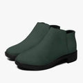 Dark green textured ankle boots with smooth black chunky heels and sleek rounded toes.