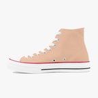 Peach high-top canvas sneaker with white laces, white rubber sole, and red trim detail.